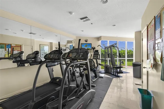 a living room with lots of furniture and a large window
