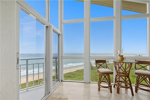 a view of an outdoor dining room with chairs