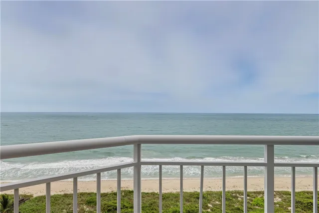 a view of a balcony with an ocean view