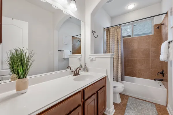 a bathroom with a sink a toilet and a bathtub