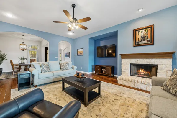 a living room with furniture and a fireplace