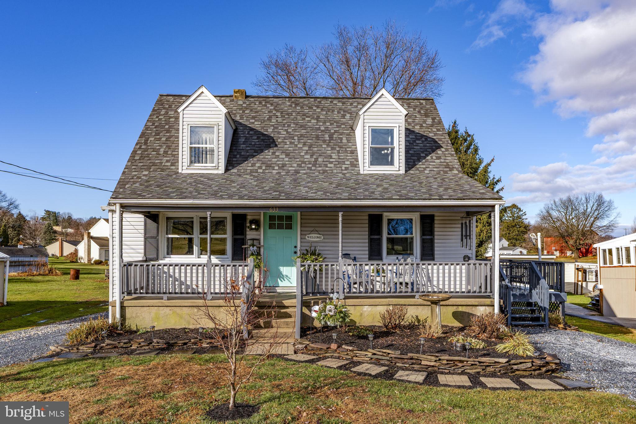 633 North Farmersville Road Ephrata, PA 17522 - Photo 1 of 54 a front view of a house with swimming pool and porch