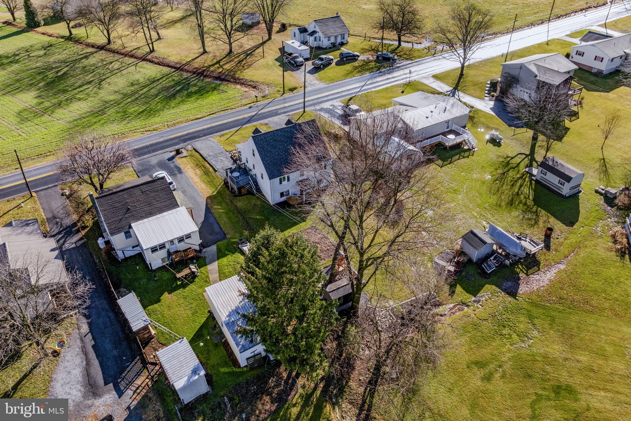 633 North Farmersville Road Ephrata, PA 17522 - Photo 17 of 54 an aerial view of a house with a yard and lake view