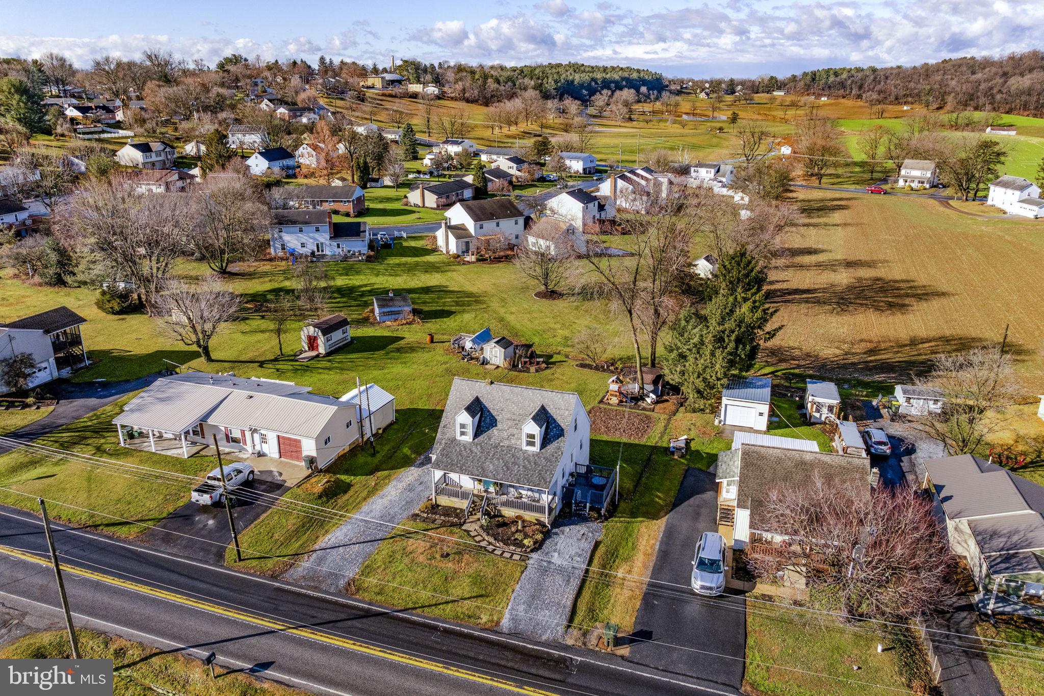 633 North Farmersville Road Ephrata, PA 17522 - Photo 2 of 54 an aerial view of a houses with a lake view