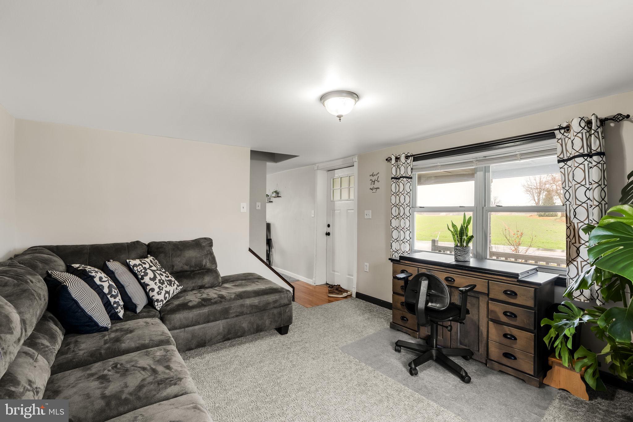 633 North Farmersville Road Ephrata, PA 17522 - Photo 27 of 54 a living room with furniture and a large window