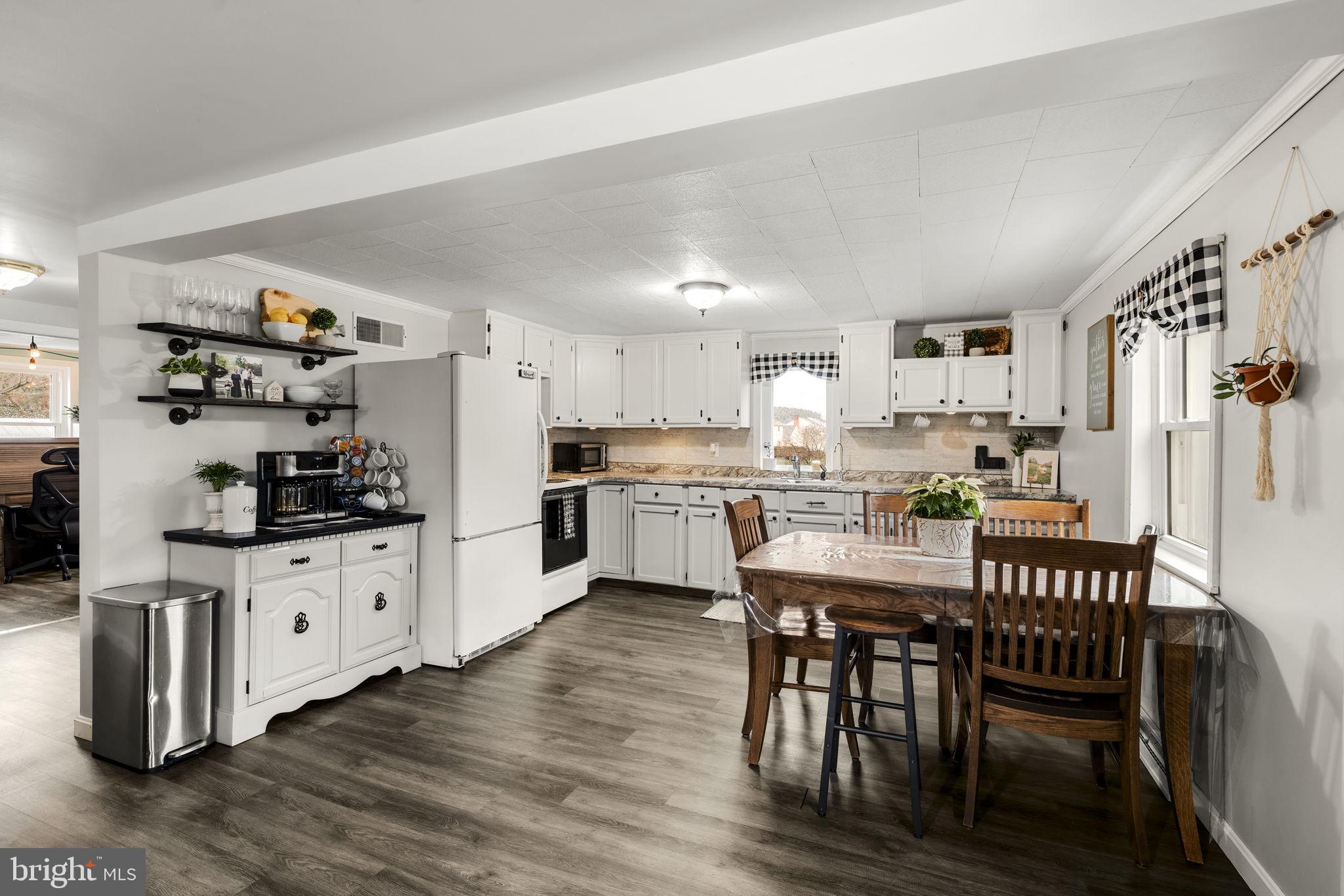633 North Farmersville Road Ephrata, PA 17522 - Photo 30 of 54 a kitchen with granite countertop white cabinets and stainless steel appliances