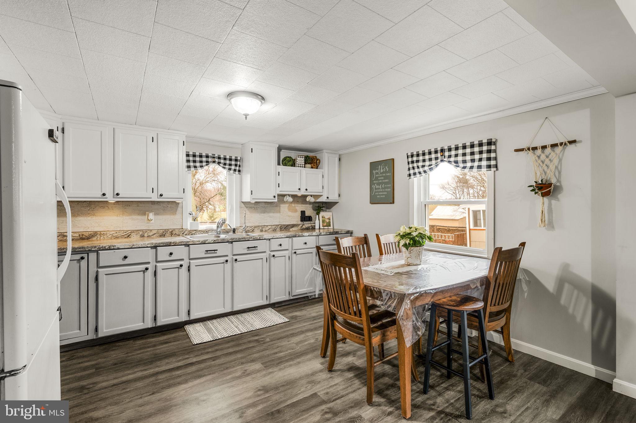 633 North Farmersville Road Ephrata, PA 17522 - Photo 31 of 54 a kitchen with granite countertop white cabinets and stainless steel appliances
