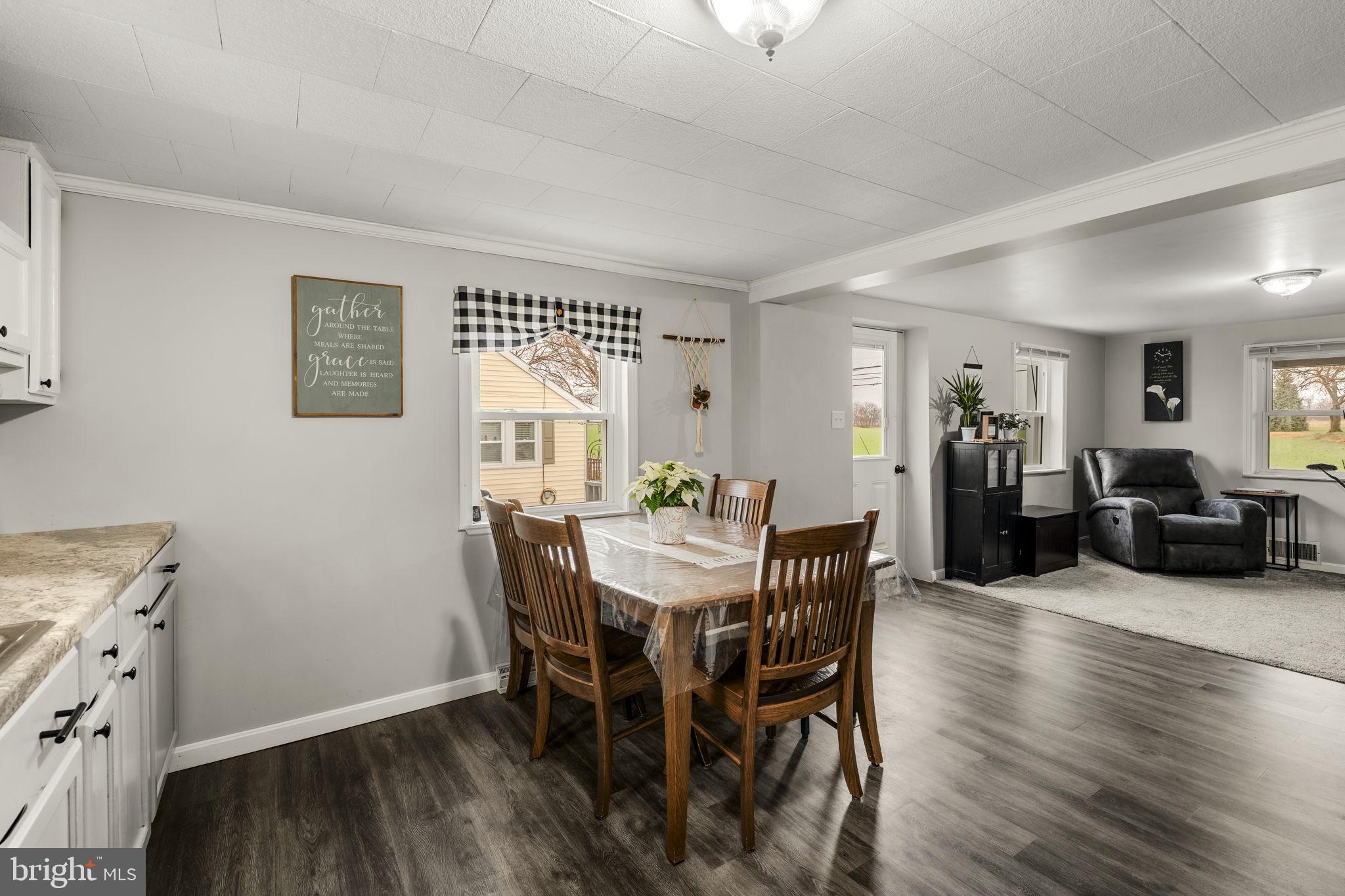 633 North Farmersville Road Ephrata, PA 17522 - Photo 32 of 54 a view of a dining room with furniture and wooden floor