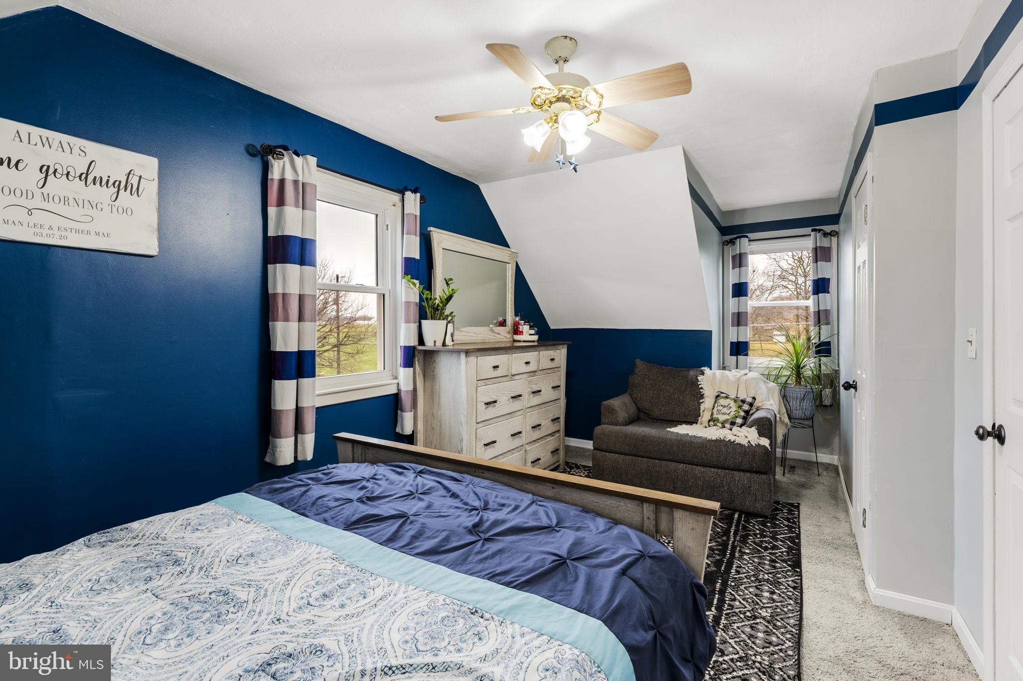 633 North Farmersville Road Ephrata, PA 17522 - Photo 40 of 54 a bedroom with a bed and a chandelier