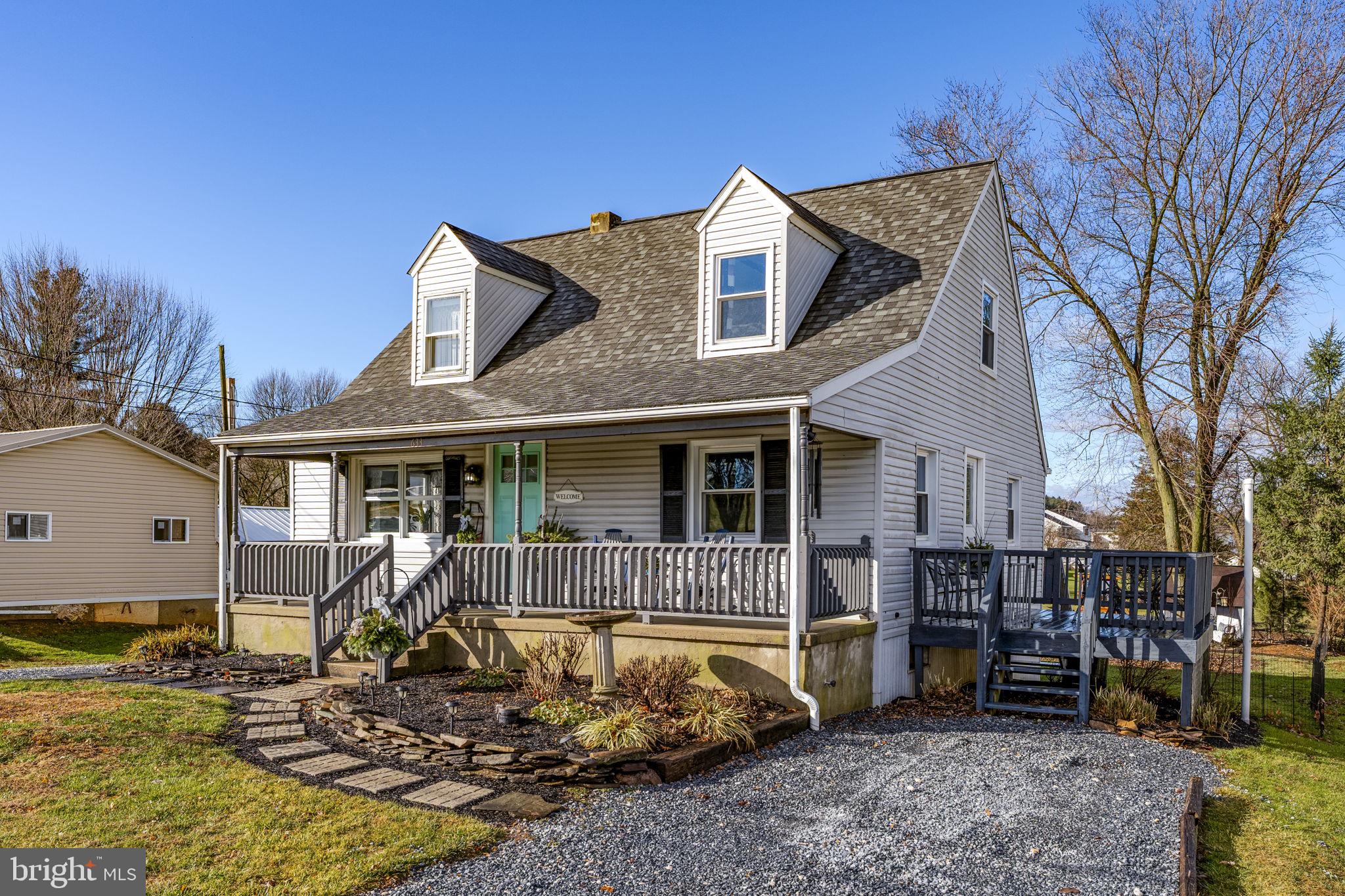 633 North Farmersville Road Ephrata, PA 17522 - Photo 4 of 54 a front view of a house with a yard