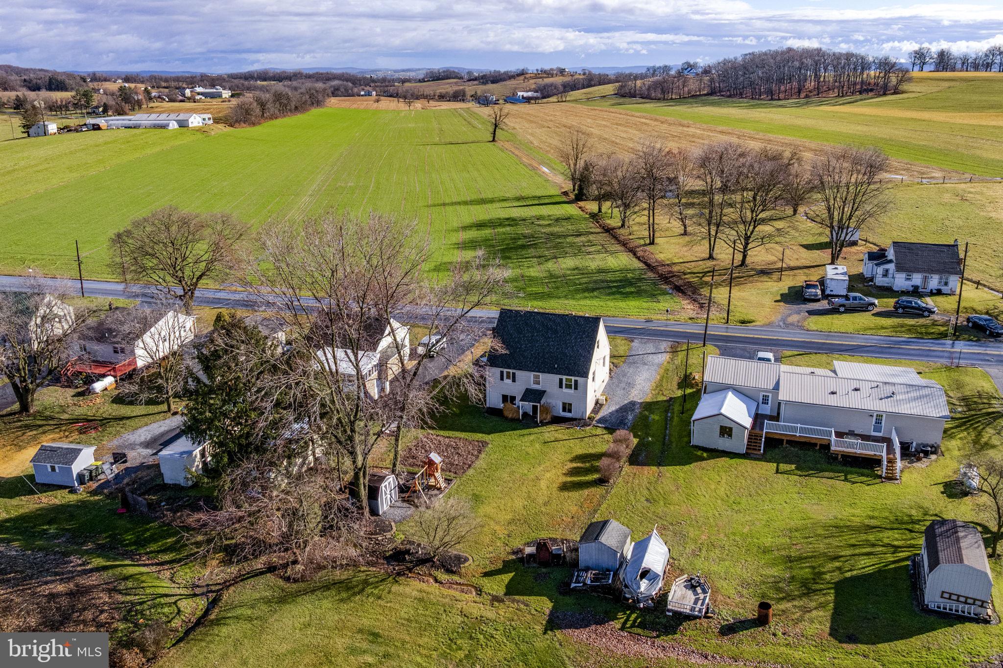 633 North Farmersville Road Ephrata, PA 17522 - Photo 10 of 54 an aerial view of a house with a garden and lake view