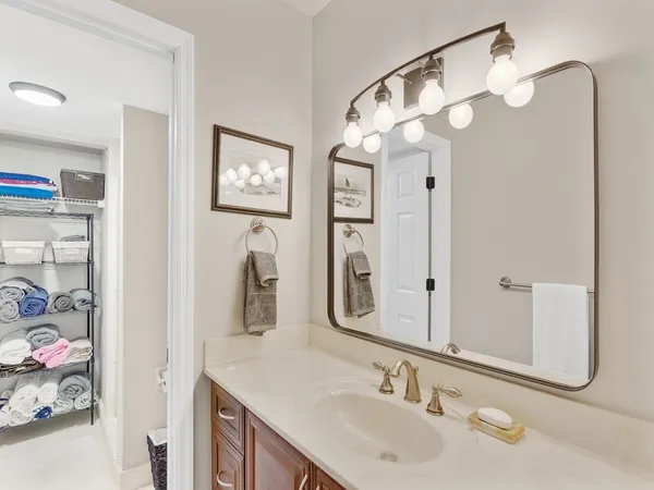 a bedroom with bed and a chandelier