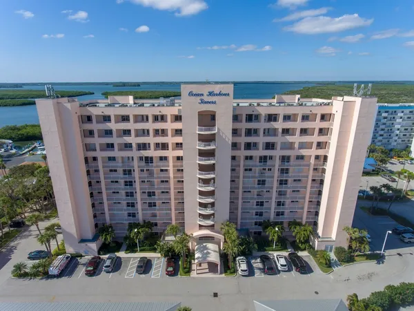 an aerial view of a house with a lake view