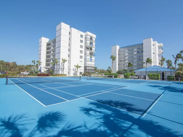 a view of a patio with a yard