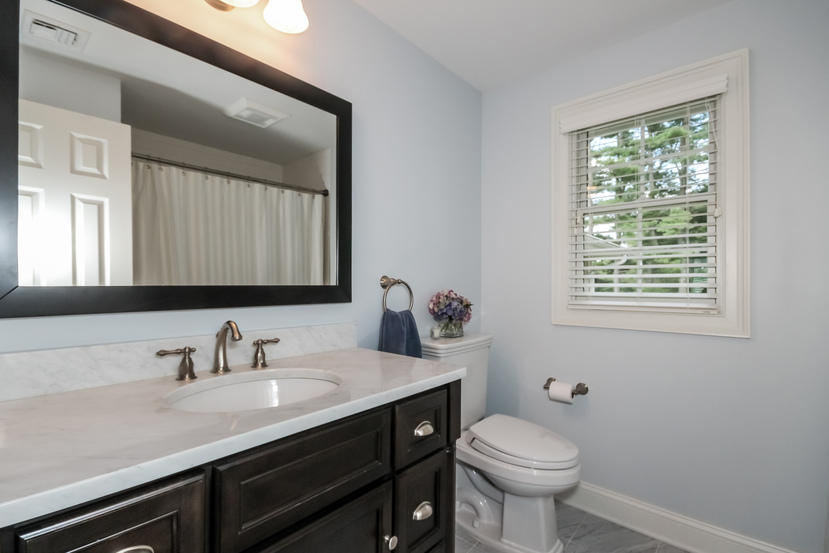 9 Field Crest Road New Canaan, CT 06840 - Photo 18 of 25 a bathroom with a toilet sink and mirror