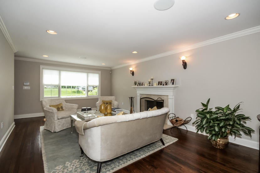 9 Field Crest Road New Canaan, CT 06840 - Photo 2 of 25 a living room with furniture potted plant and a fireplace