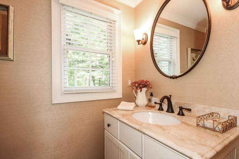 9 Field Crest Road New Canaan, CT 06840 - Photo 10 of 25 a bathroom with a granite countertop sink and a mirror