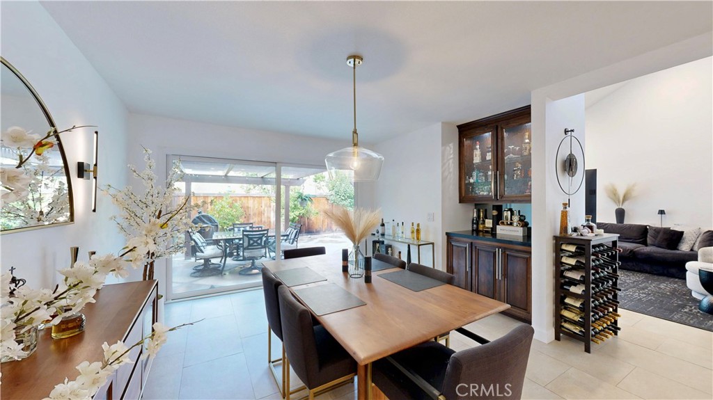 1421 Rust Court Claremont, CA 91711 - Photo 13 of 47 a dining room with furniture a chandelier and wooden floor