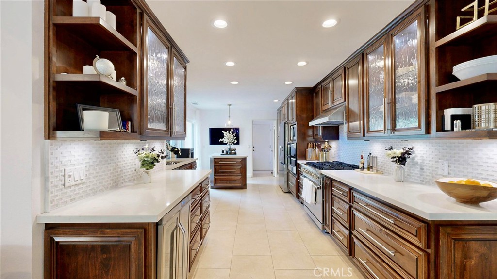 1421 Rust Court Claremont, CA 91711 - Photo 15 of 47 a kitchen with kitchen island granite countertop a sink and cabinets