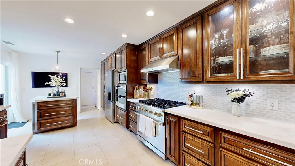 1421 Rust Court Claremont, CA 91711 - Photo 16 of 47 a kitchen with stainless steel appliances a sink stove and cabinets