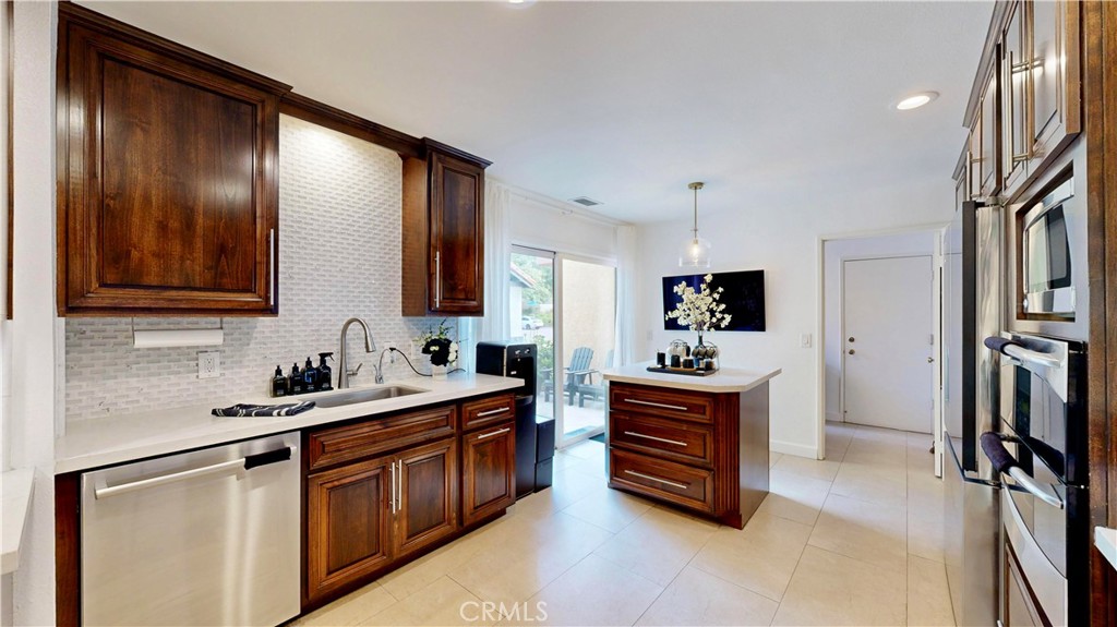 1421 Rust Court Claremont, CA 91711 - Photo 18 of 47 a kitchen with stainless steel appliances granite countertop a sink stove and refrigerator