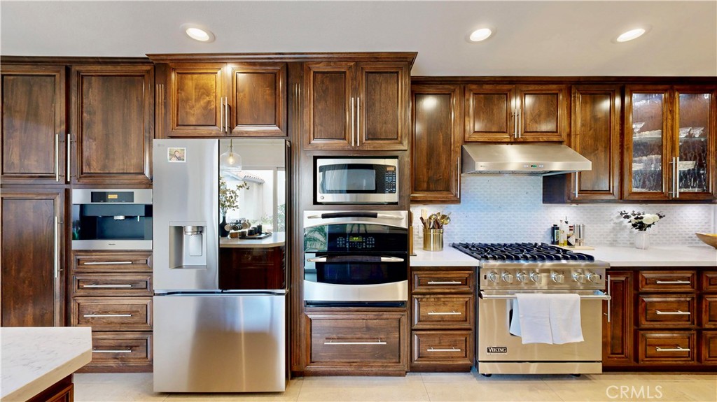 1421 Rust Court Claremont, CA 91711 - Photo 19 of 47 a kitchen with stainless steel appliances granite countertop a stove and a refrigerator