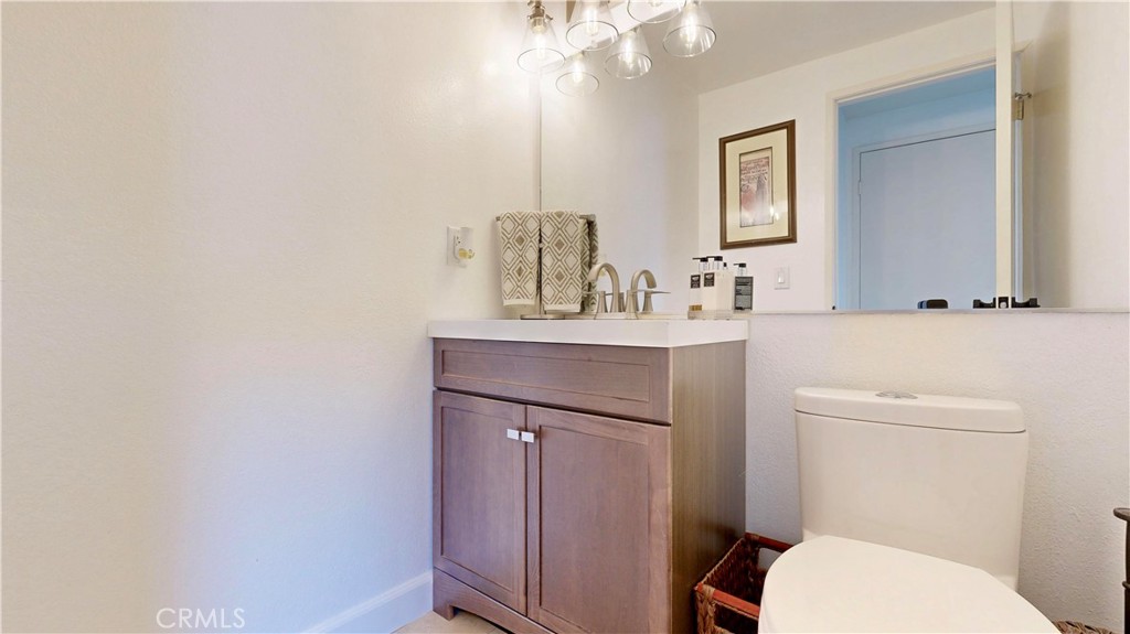 1421 Rust Court Claremont, CA 91711 - Photo 22 of 47 a bathroom with a sink vanity mirror and toilet