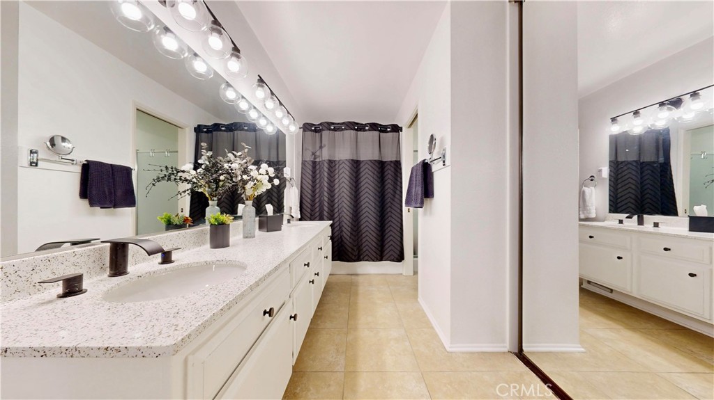 1421 Rust Court Claremont, CA 91711 - Photo 28 of 47 a bathroom with a double vanity sink mirror and shower