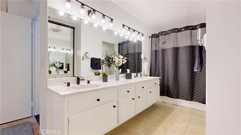 1421 Rust Court Claremont, CA 91711 - Photo 29 of 47 a bathroom with a double vanity sink mirror and shower