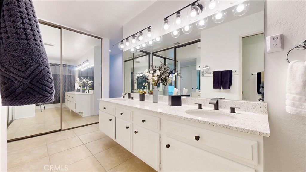 1421 Rust Court Claremont, CA 91711 - Photo 30 of 47 a bathroom with a double vanity sink mirror and bathtub