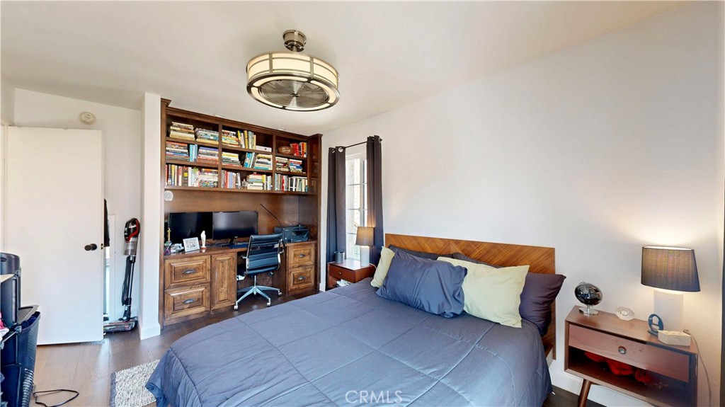 1421 Rust Court Claremont, CA 91711 - Photo 32 of 47 a bedroom with a bed and a chandelier