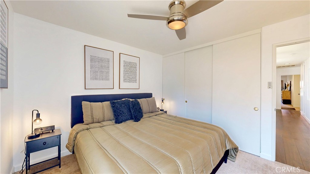 1421 Rust Court Claremont, CA 91711 - Photo 33 of 47 a bedroom with a bed and a chandelier