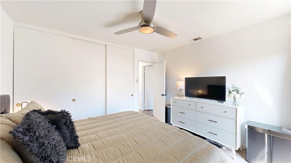 1421 Rust Court Claremont, CA 91711 - Photo 34 of 47 a bedroom with a bed and a flat screen tv