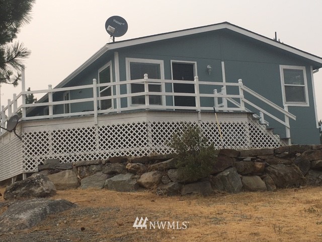 94 Main Road Tonasket, WA 98855 - Photo 2 of 25 a front view of a house