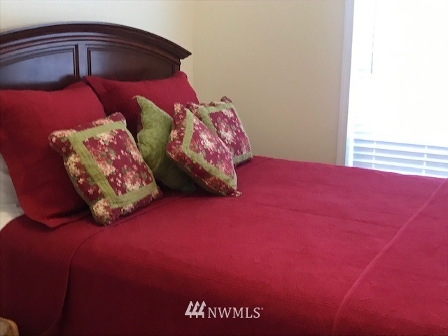 94 Main Road Tonasket, WA 98855 - Photo 12 of 25 a bedroom with a bed and a night stand