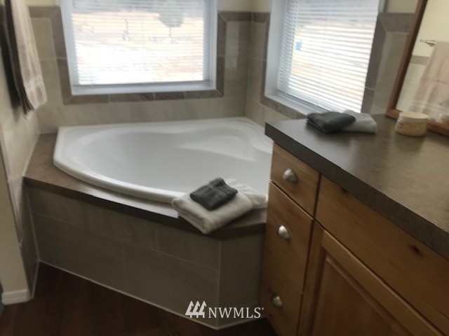94 Main Road Tonasket, WA 98855 - Photo 15 of 25 a bathroom with a sink and a window