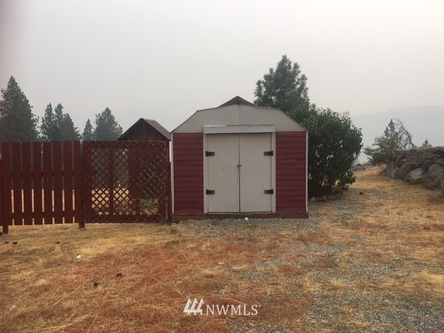 94 Main Road Tonasket, WA 98855 - Photo 25 of 25 a view of a house with a yard