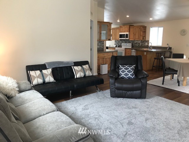 94 Main Road Tonasket, WA 98855 - Photo 4 of 25 a living room with furniture and a dining table with kitchen view