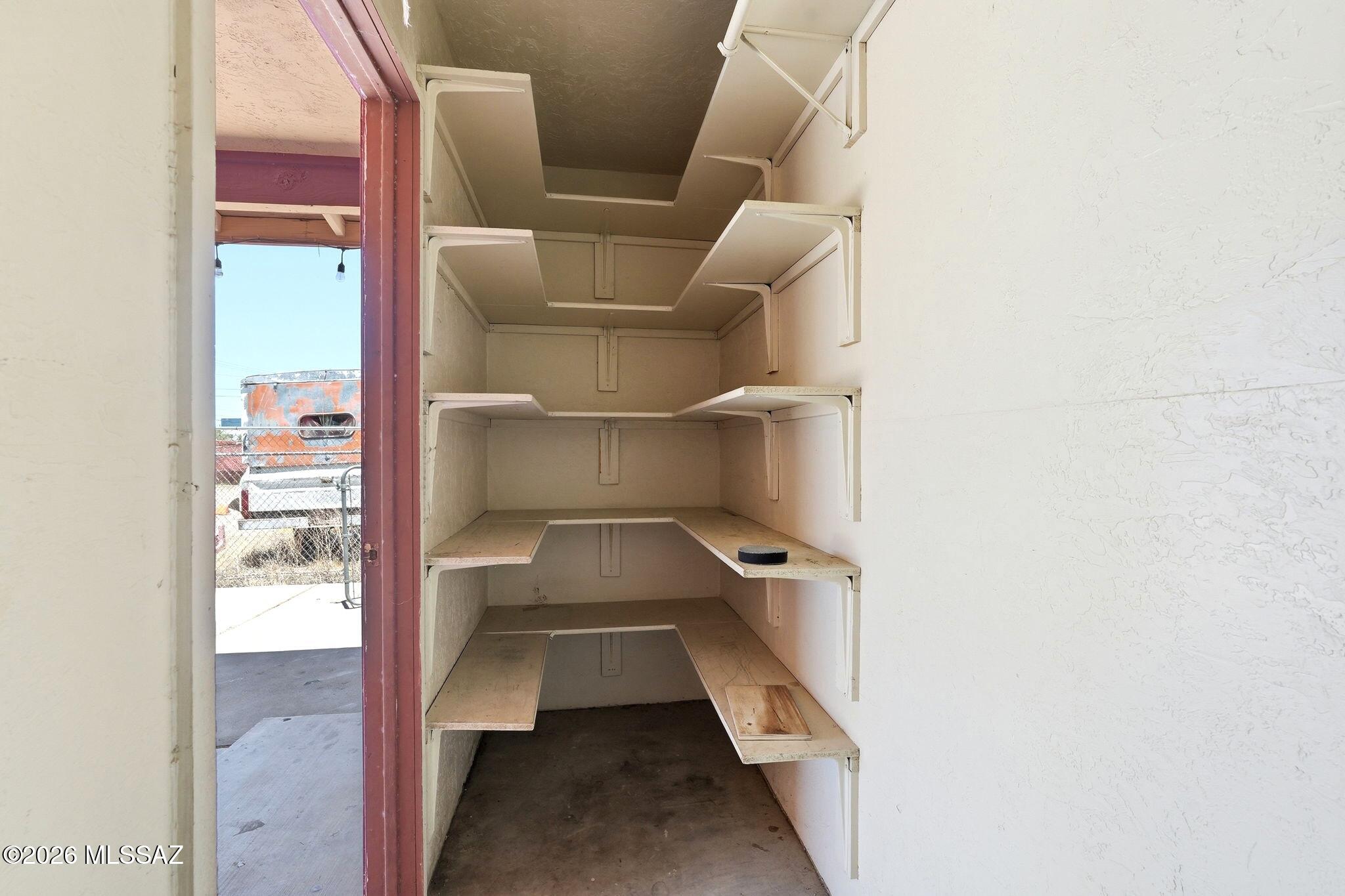 5125 South Missiondale Road Tucson, AZ 85706 - Photo 28 of 32 a view of walk in closet with empty racks