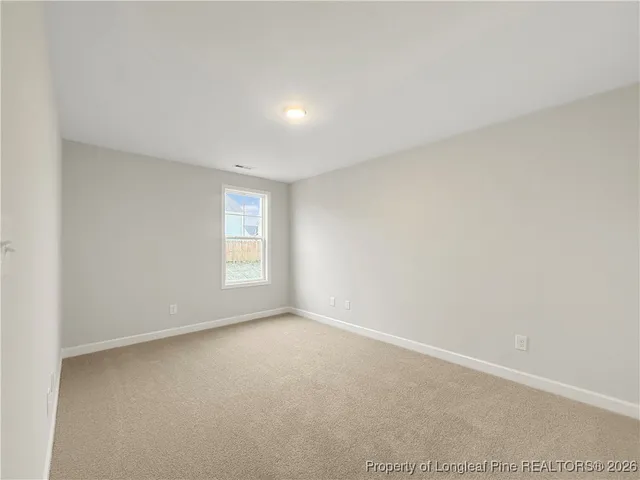 a view of a closet with wooden floor