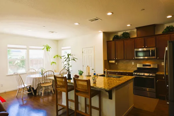 a bathroom with a sink and large mirror