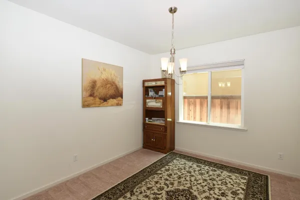 a bedroom with bed couch and window