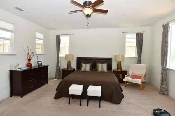 a bedroom with furniture and window