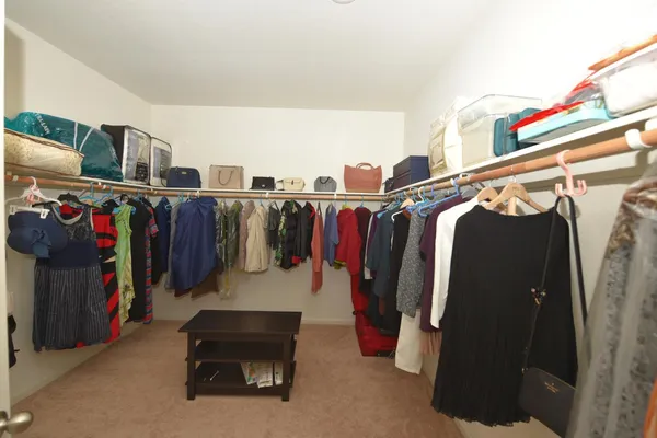 a view of an entryway with table and mirror