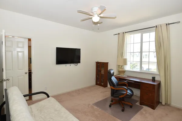 a bathroom with double vanity and a mirror
