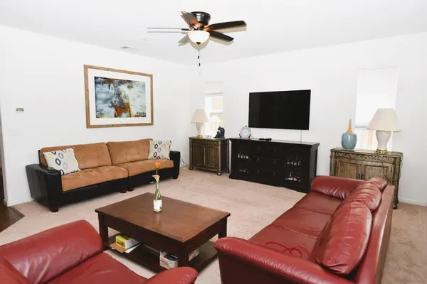 a living room with furniture and a large window