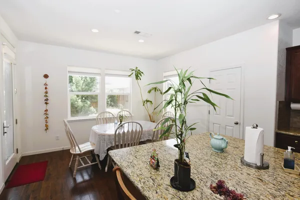 a view of a dining room with furniture window and outside view