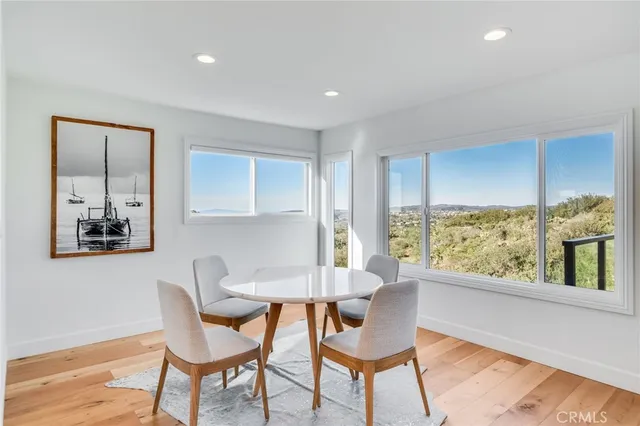 a living room with a bed furniture and a flat screen tv