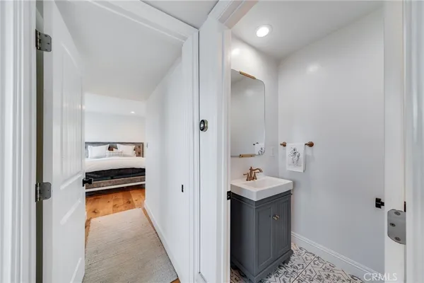 a bedroom with a bed and large window