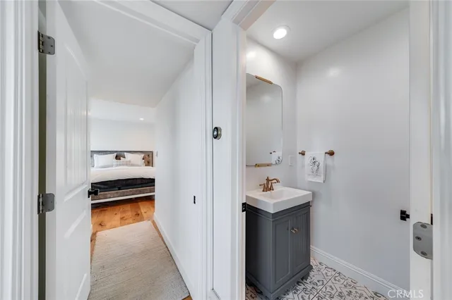 a bedroom with a bed and large window